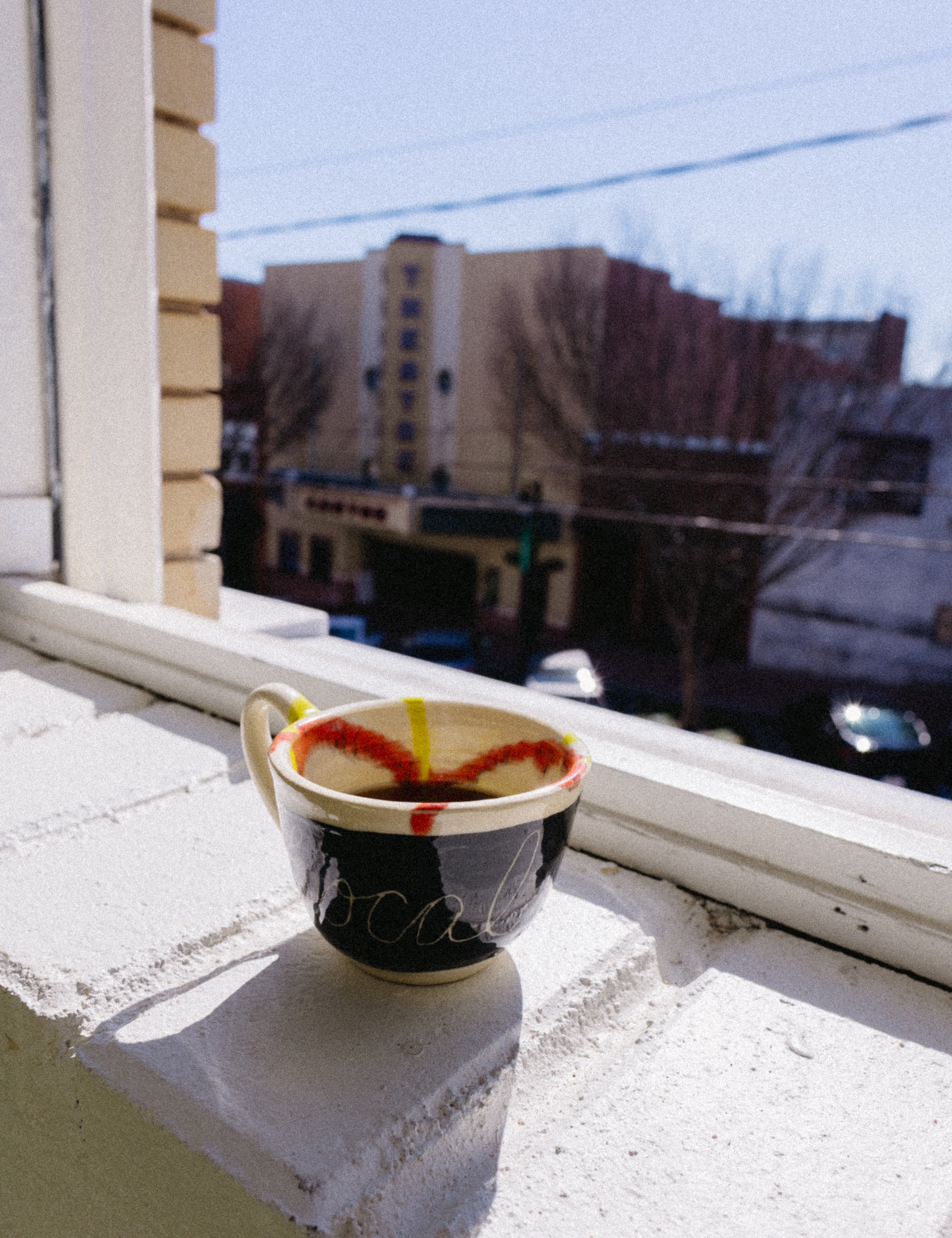 A mug in a window. 