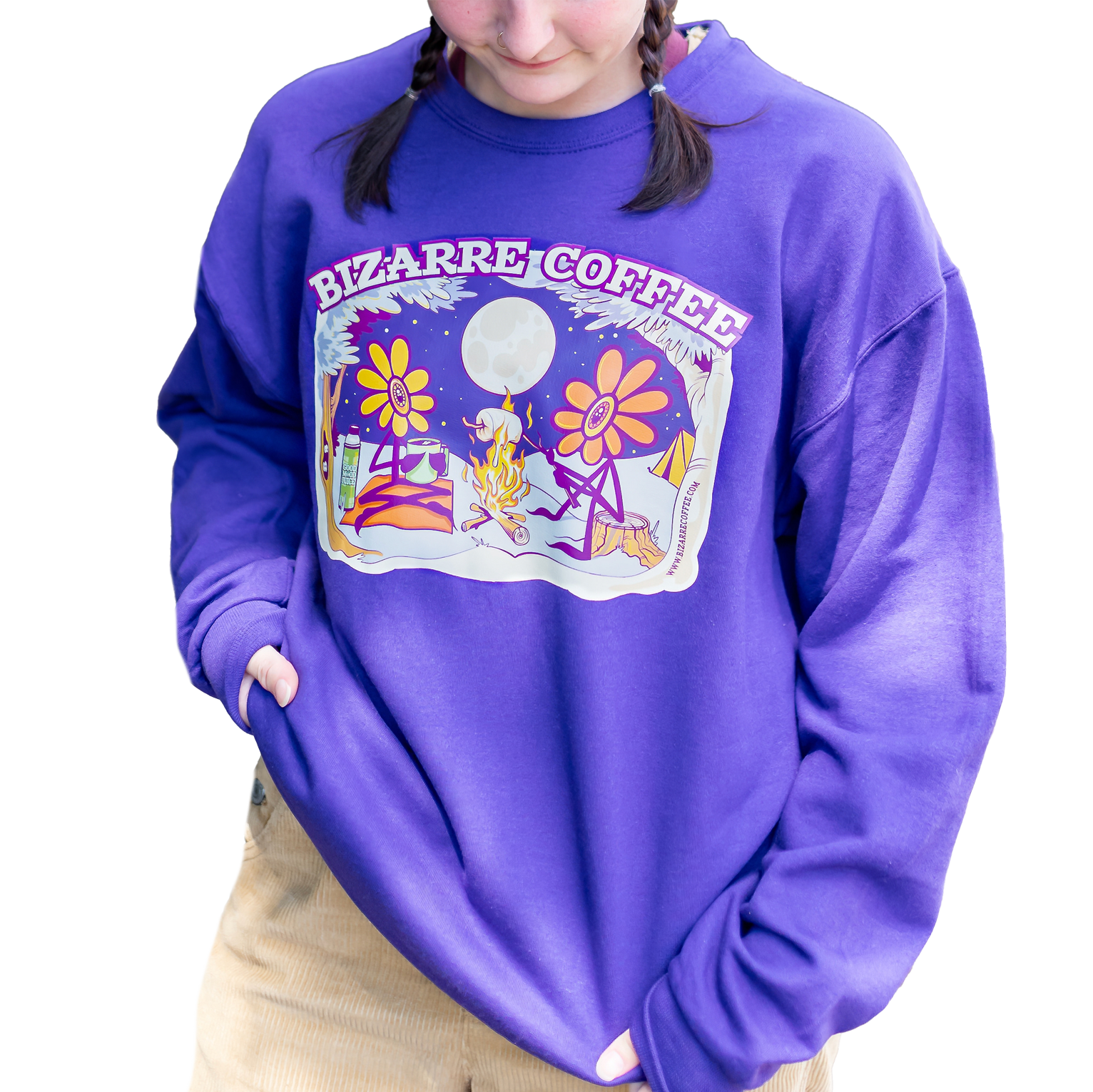 A Bizarre Coffee purple crewneck sweater with a campfire design featuring two flowers roasting marshmallows and sipping coffee.