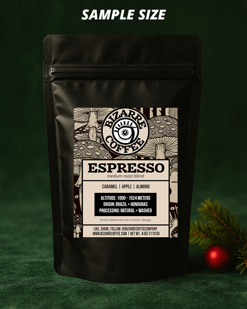 Bizarre Coffee Espresso sample size packaging on a green background with Christmas decorations.