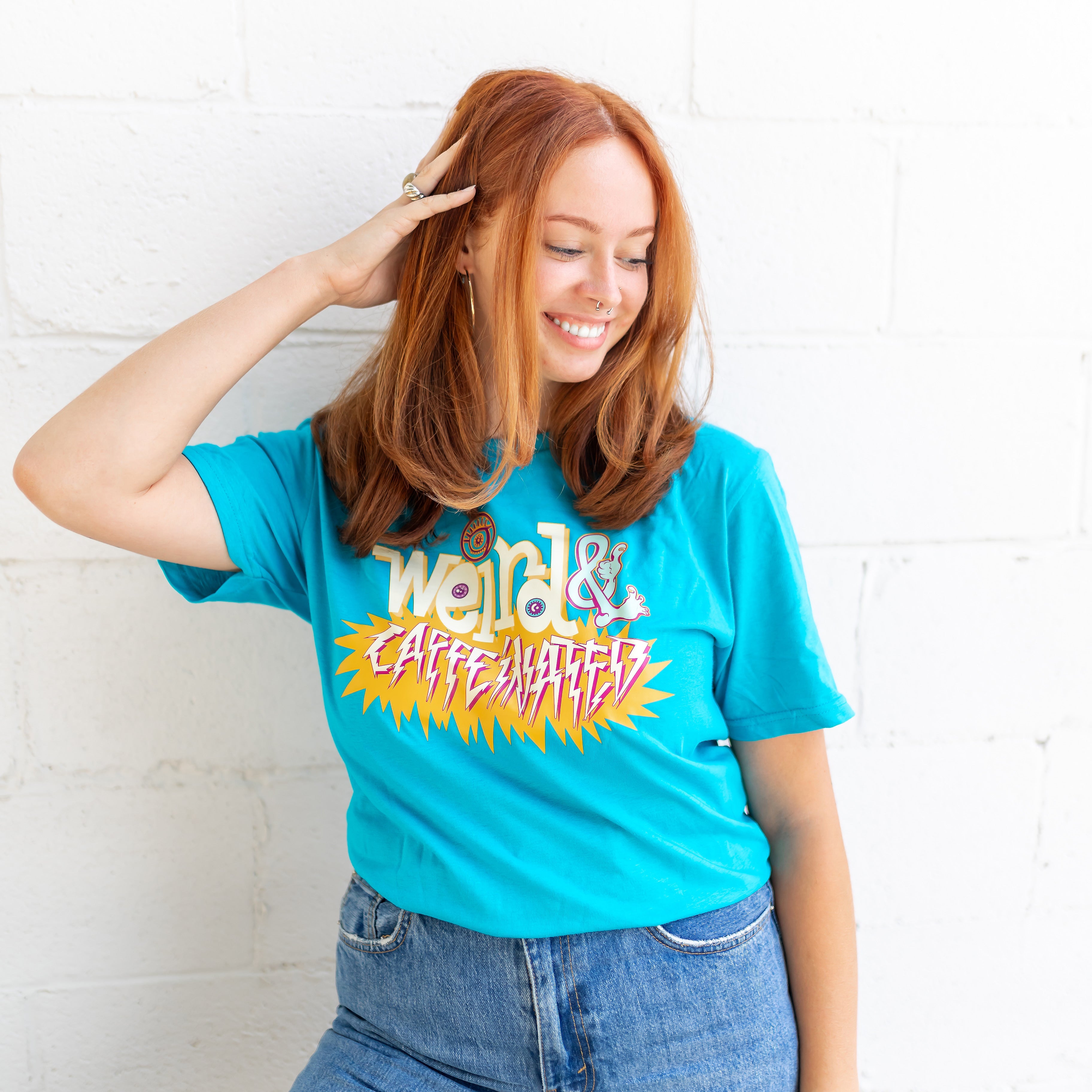 A person wearing a Bizarre Coffee "Weird & Caffeinated" Shirt.