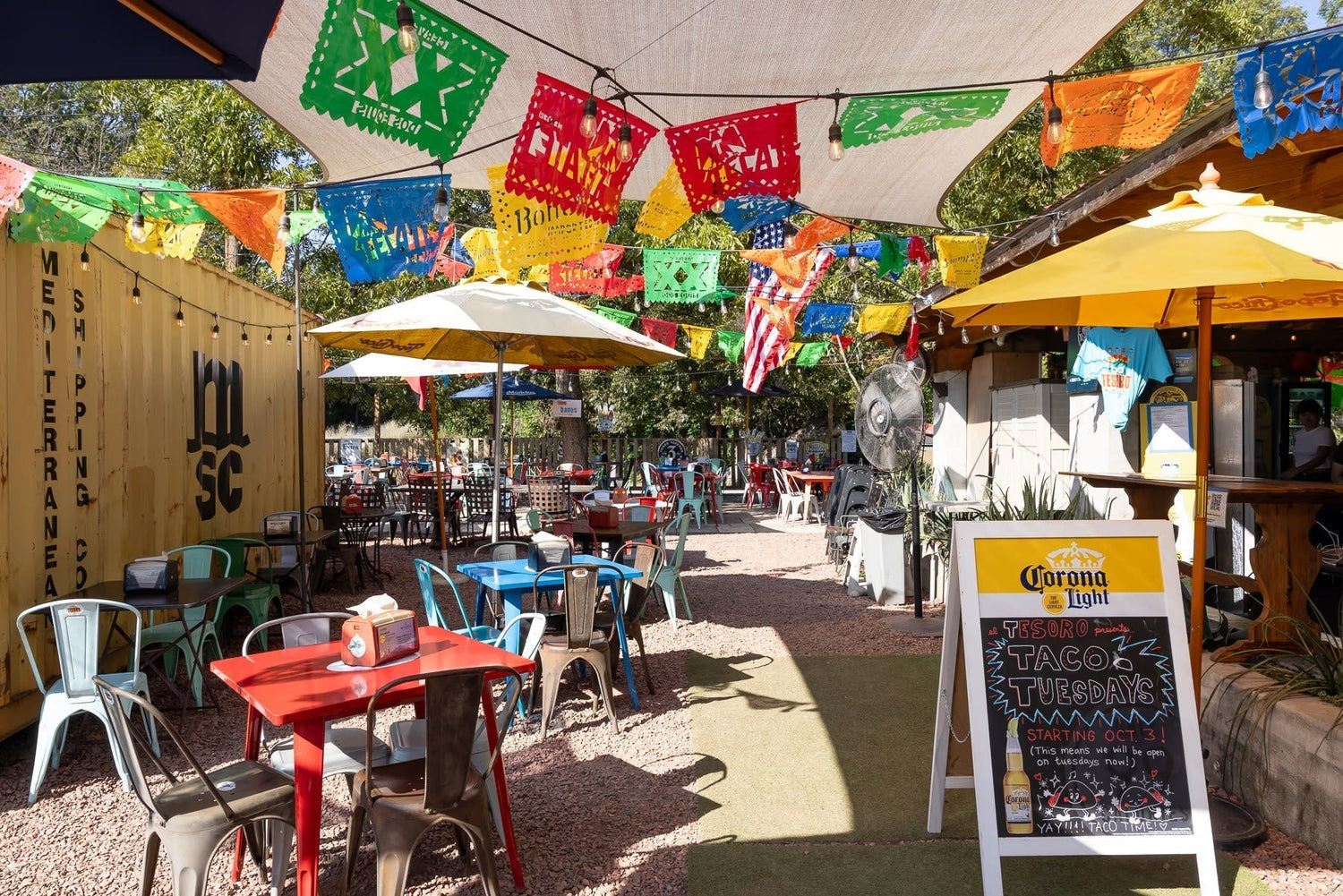 Outdoor patio space with colorful flags in Atlanta