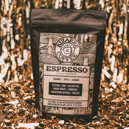 A bag of Espresso Medium Roast Blend with gold tinsel in the background.