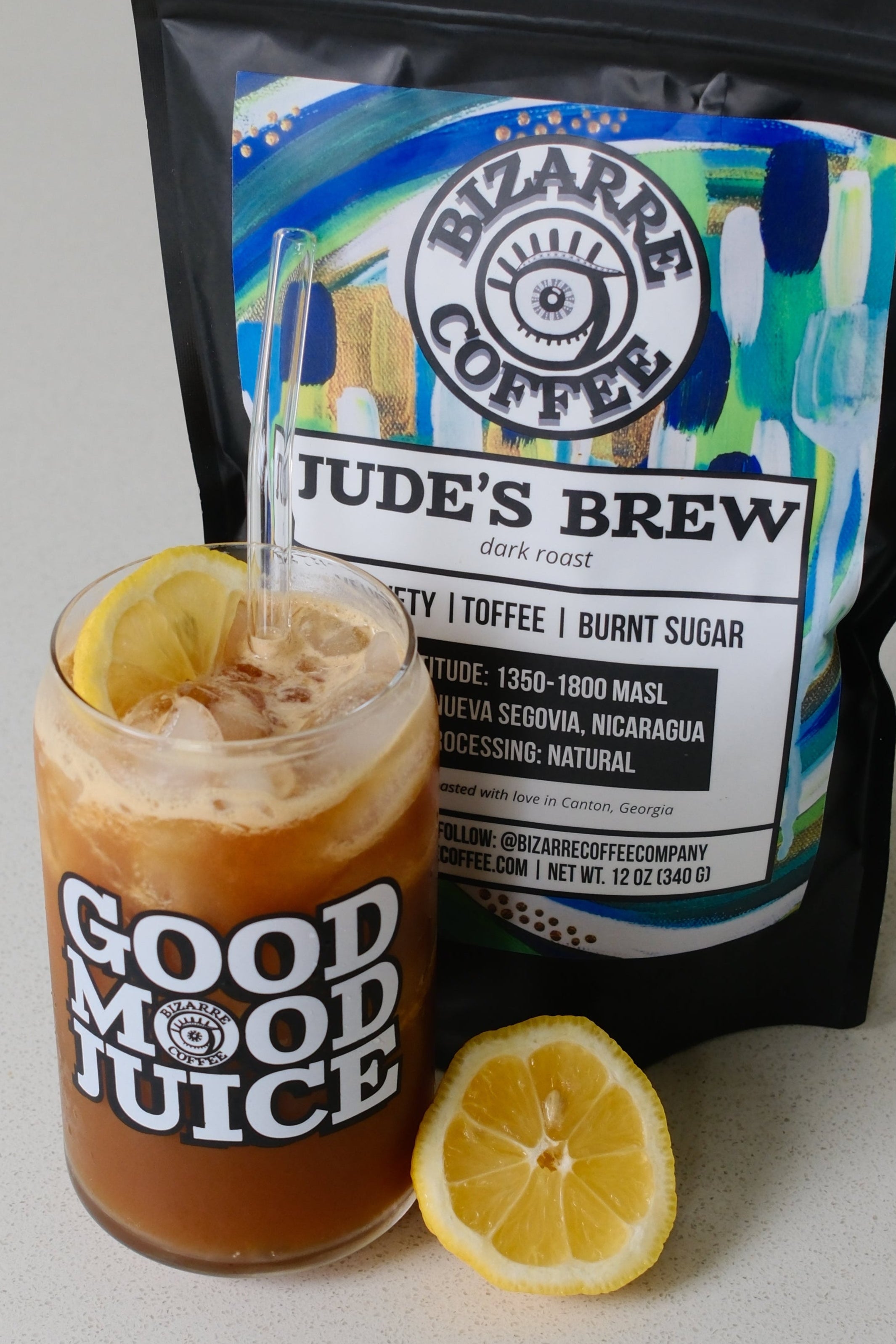 Judes Brew Coffee container with a glass that says Good Mood Juice.