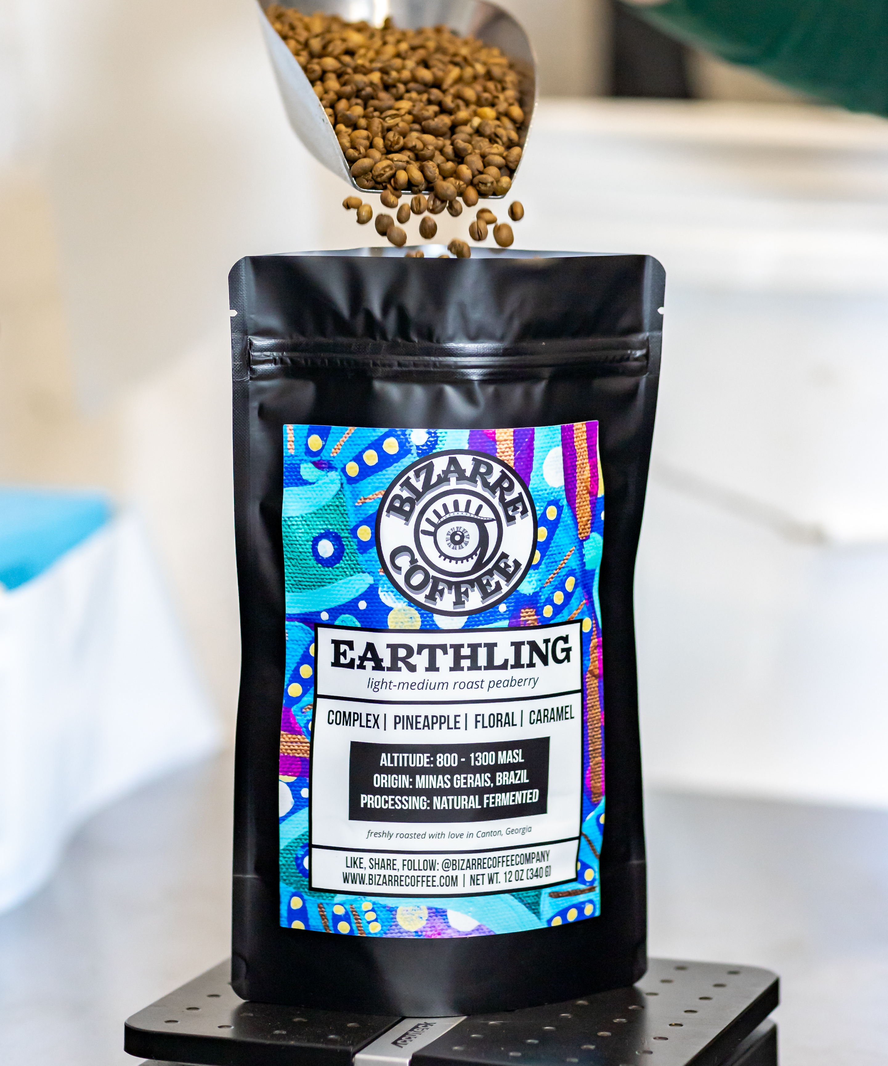 A bag of earthling coffee with coffee beans.